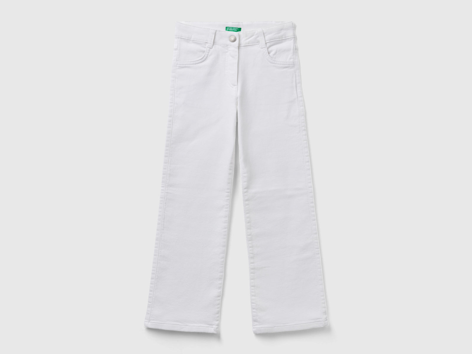 Pantaloni a zampa stretch da bambina bianco | Benetton Outlet