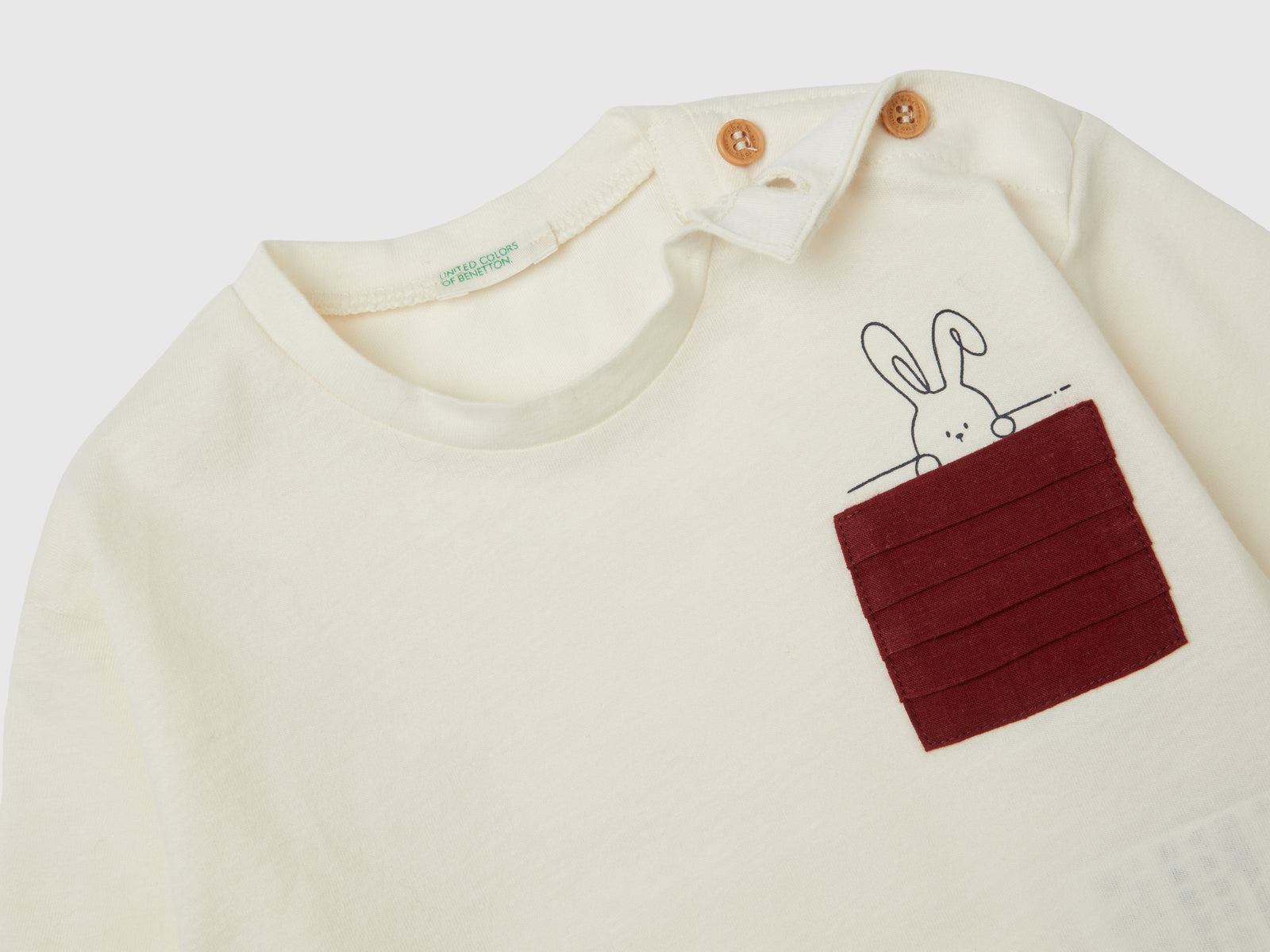 Maglietta con taschino plissettato da neonato bianco panna 2 | Benetton Outlet