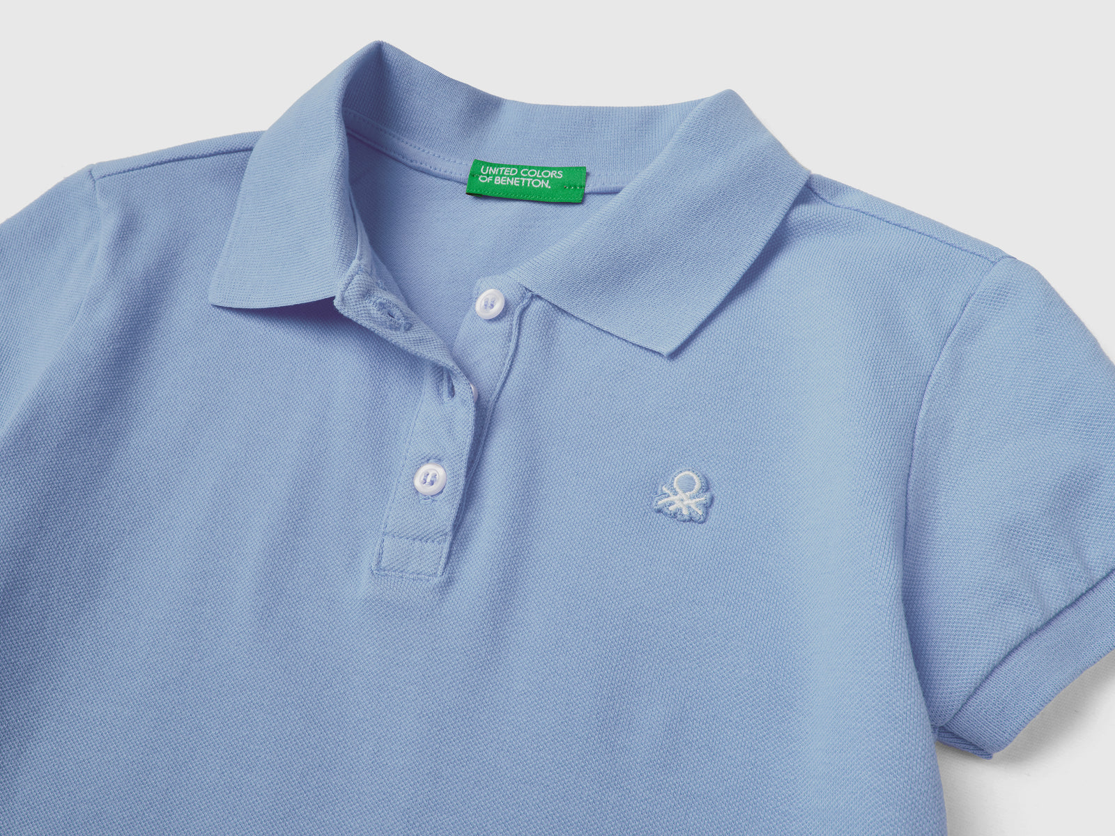 Polo a manica corta in piquet di cotone elasticizzato da bambina pervinca 2 | Benetton Outlet