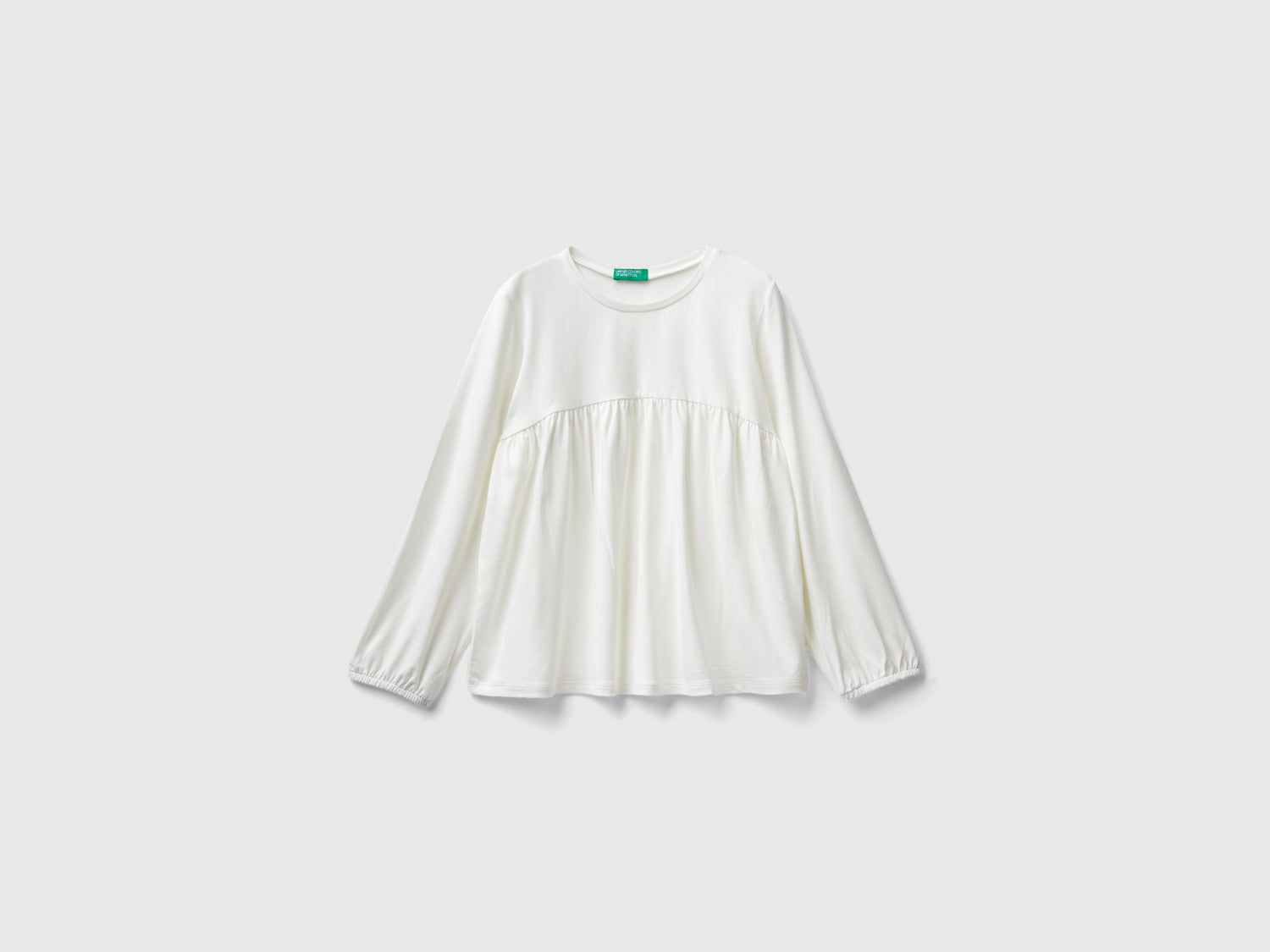 Maglietta fluida stretch da bambina bianco panna | Benetton Outlet