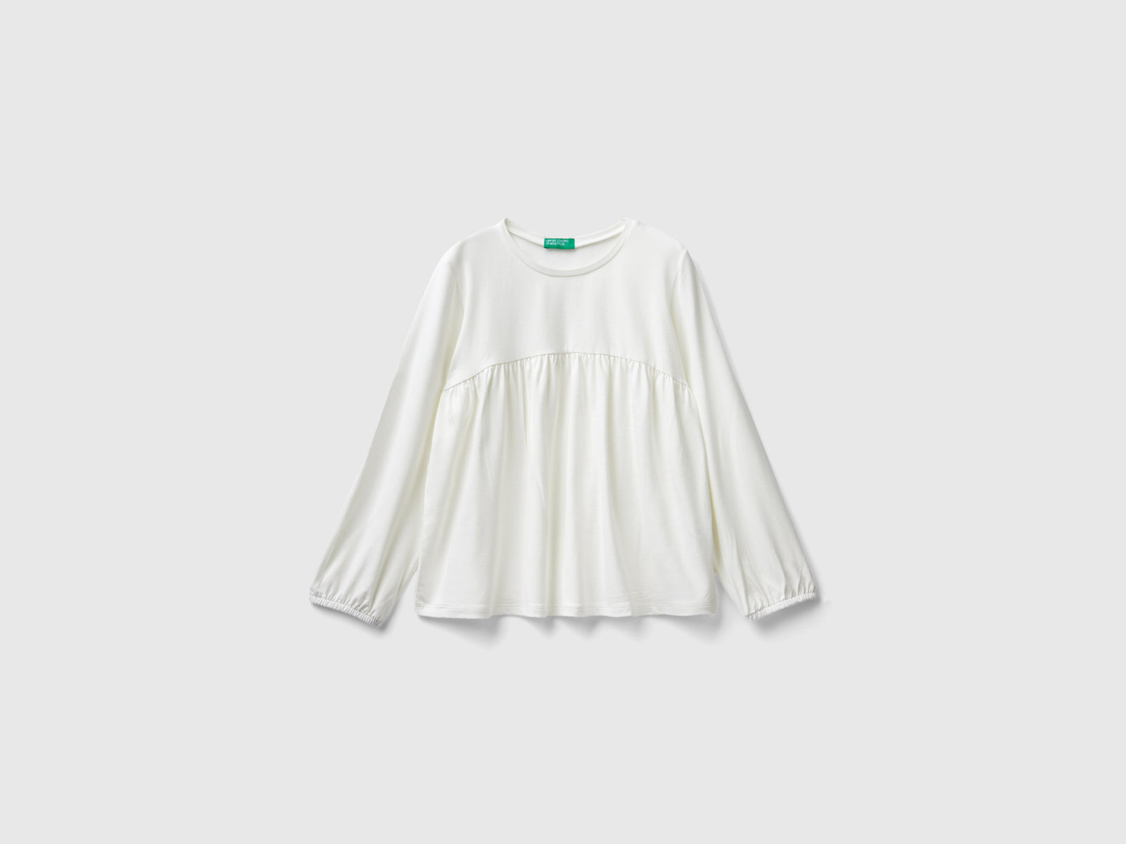 Maglietta fluida stretch da bambina bianco panna | Benetton Outlet