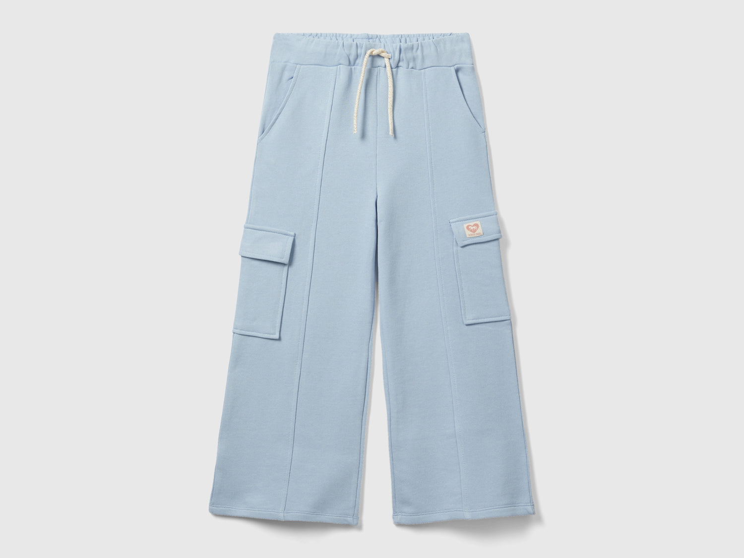 Pantaloni ampi in felpa da bambina celeste | Benetton Outlet