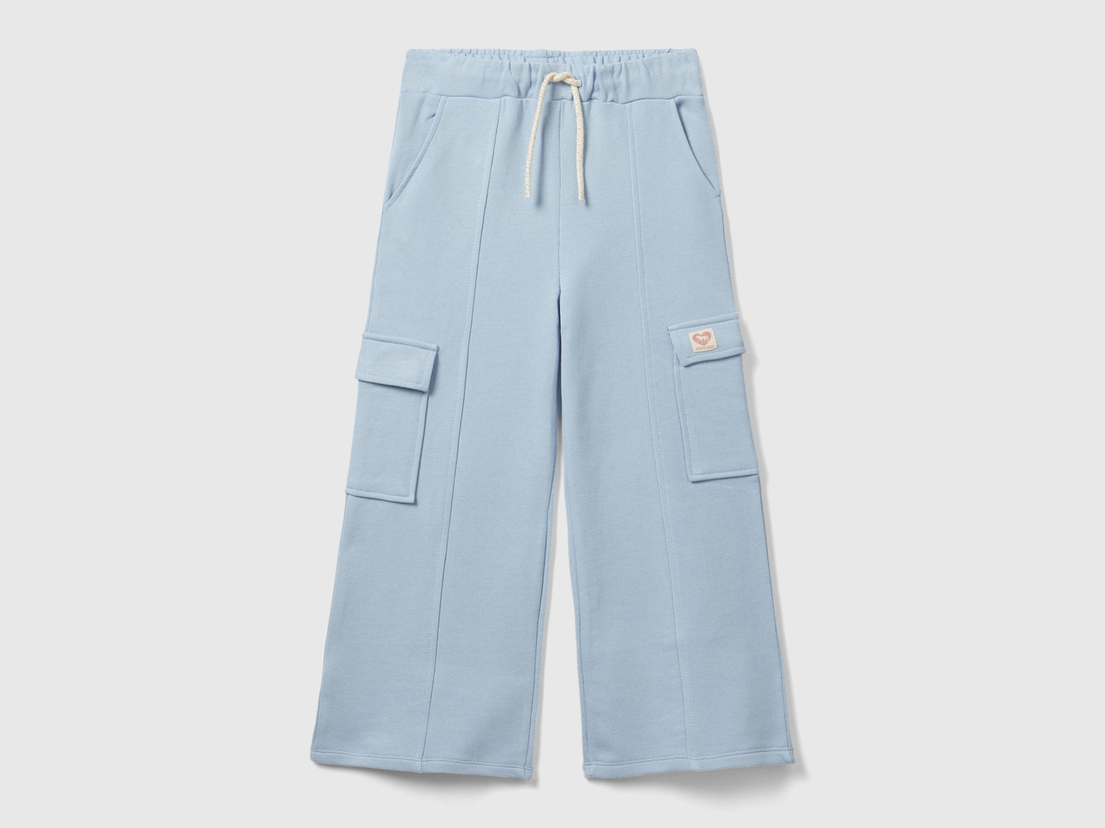 Pantaloni ampi in felpa da bambina celeste | Benetton Outlet