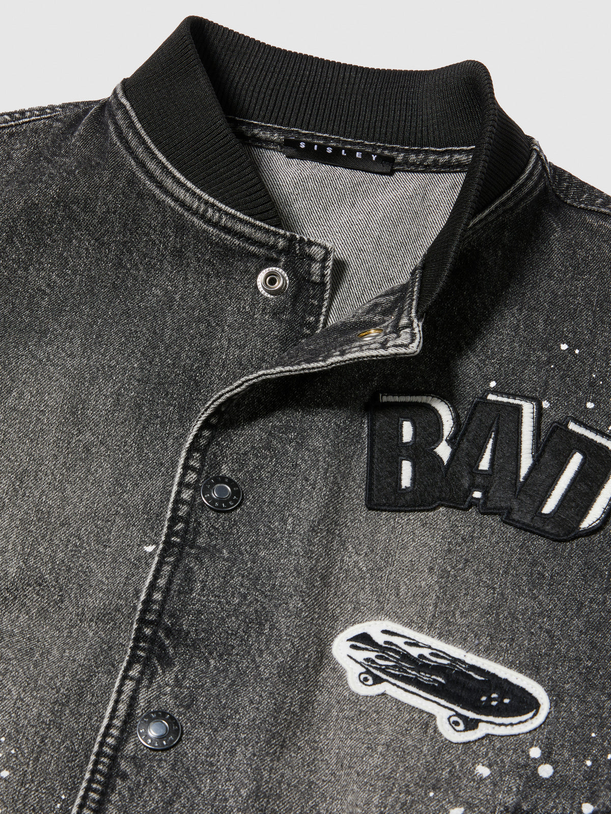 Bomber di jeans effetto spruzzato
