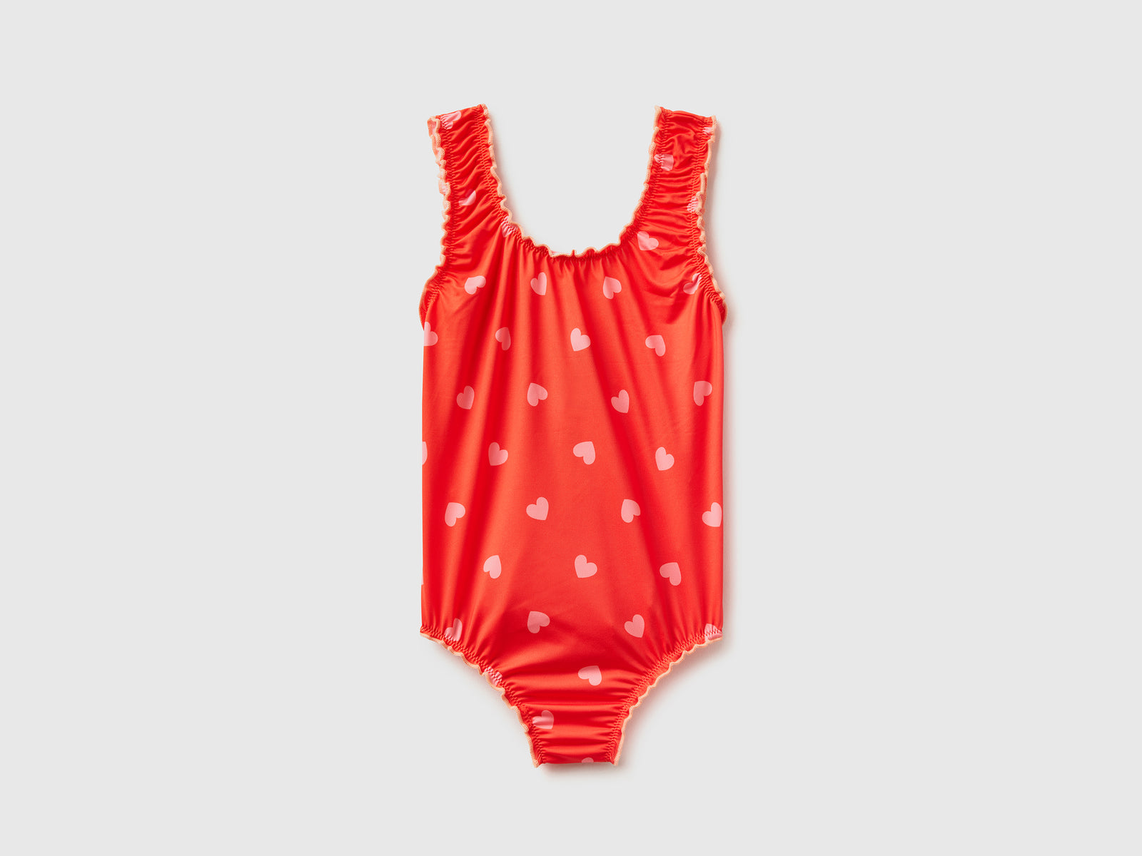 Costume intero in tessuto elasticizzato con stampa cuori da bambina rosso | Benetton Outlet