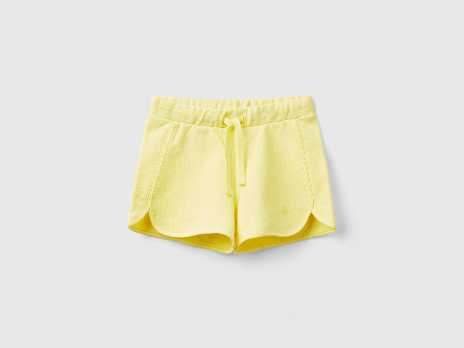 Shorts in felpa 100% cotone bio da bimba giallo | Benetton Outlet