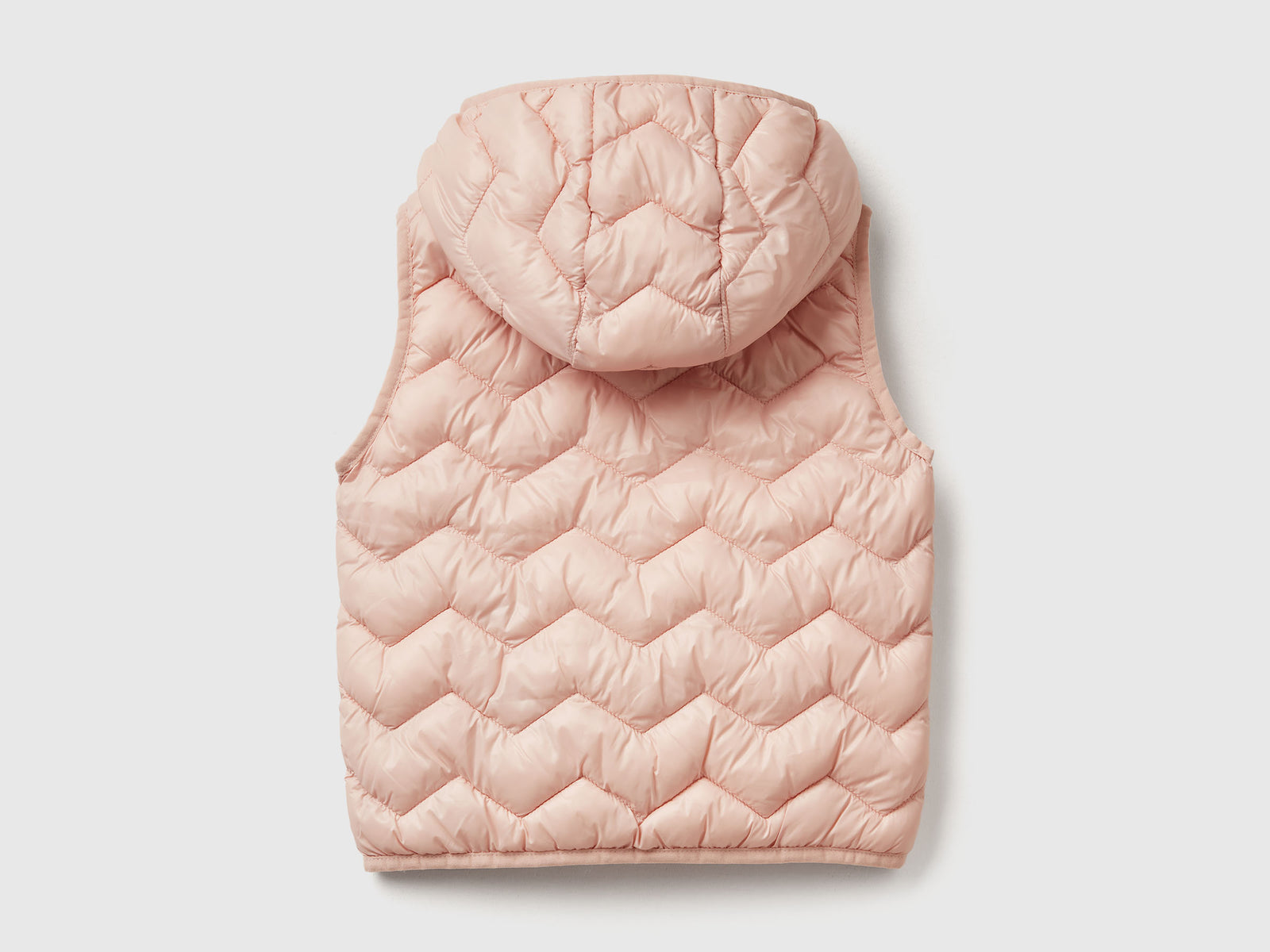 Gilet imbottito con cappuccio da bimba rosa tenue 2 | Benetton Outlet