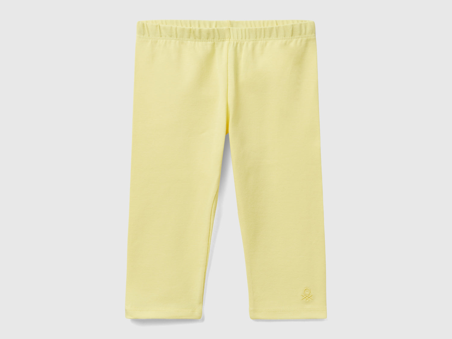 Leggings a 3/4 in cotone elasticizzato da bimba giallo | Benetton Outlet