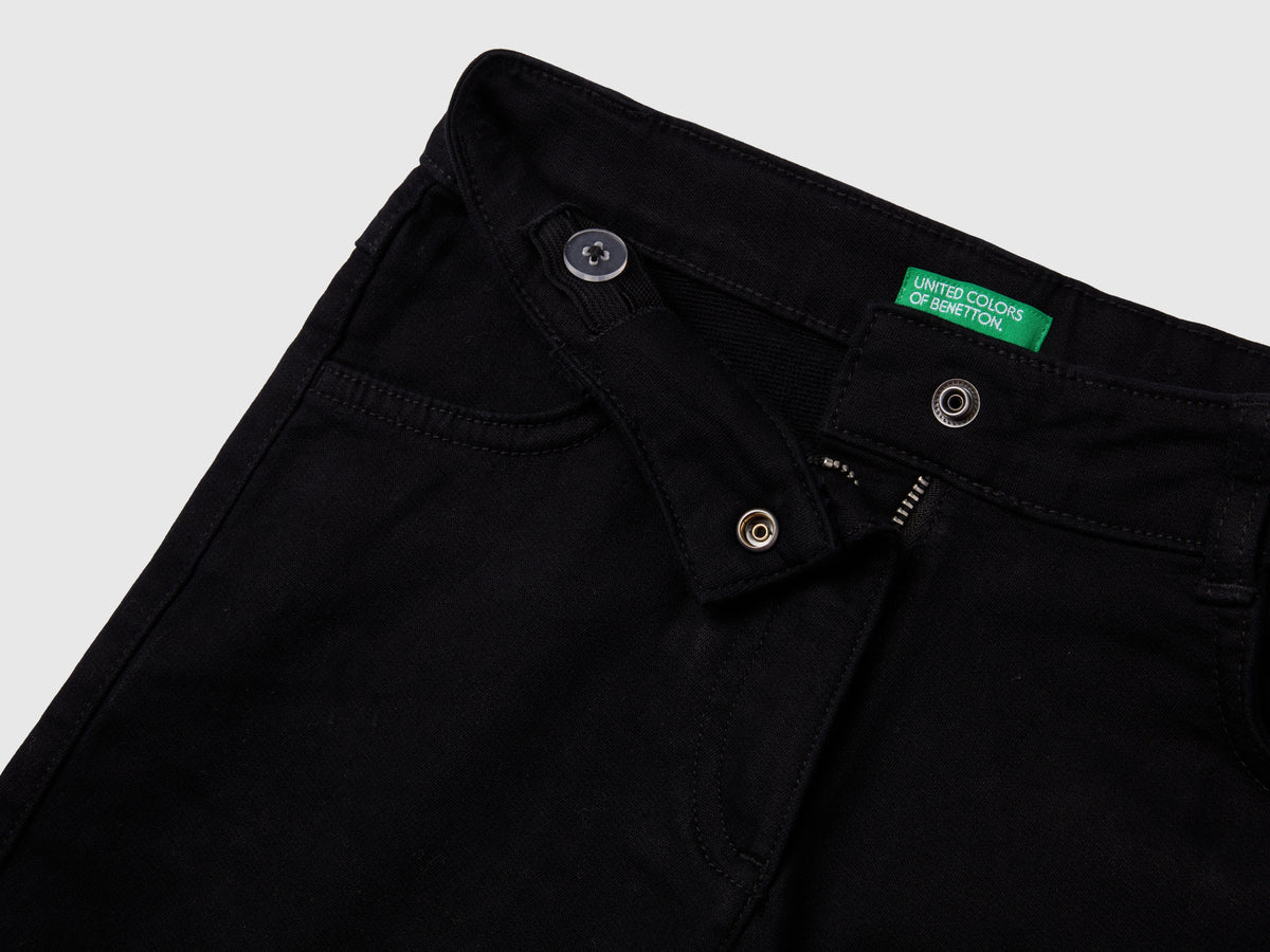 Pantaloni a zampa stretch