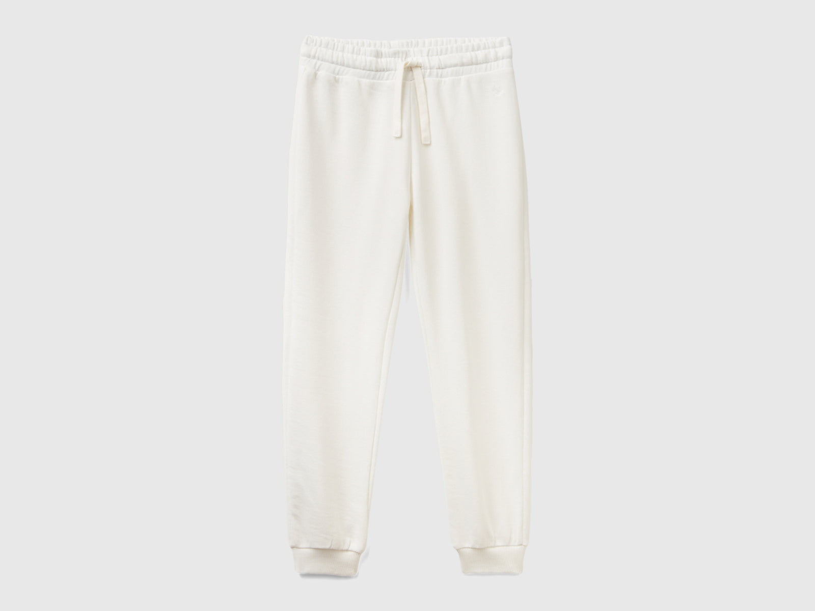 Pantaloni in felpa con logo da bambina bianco panna | Benetton Outlet