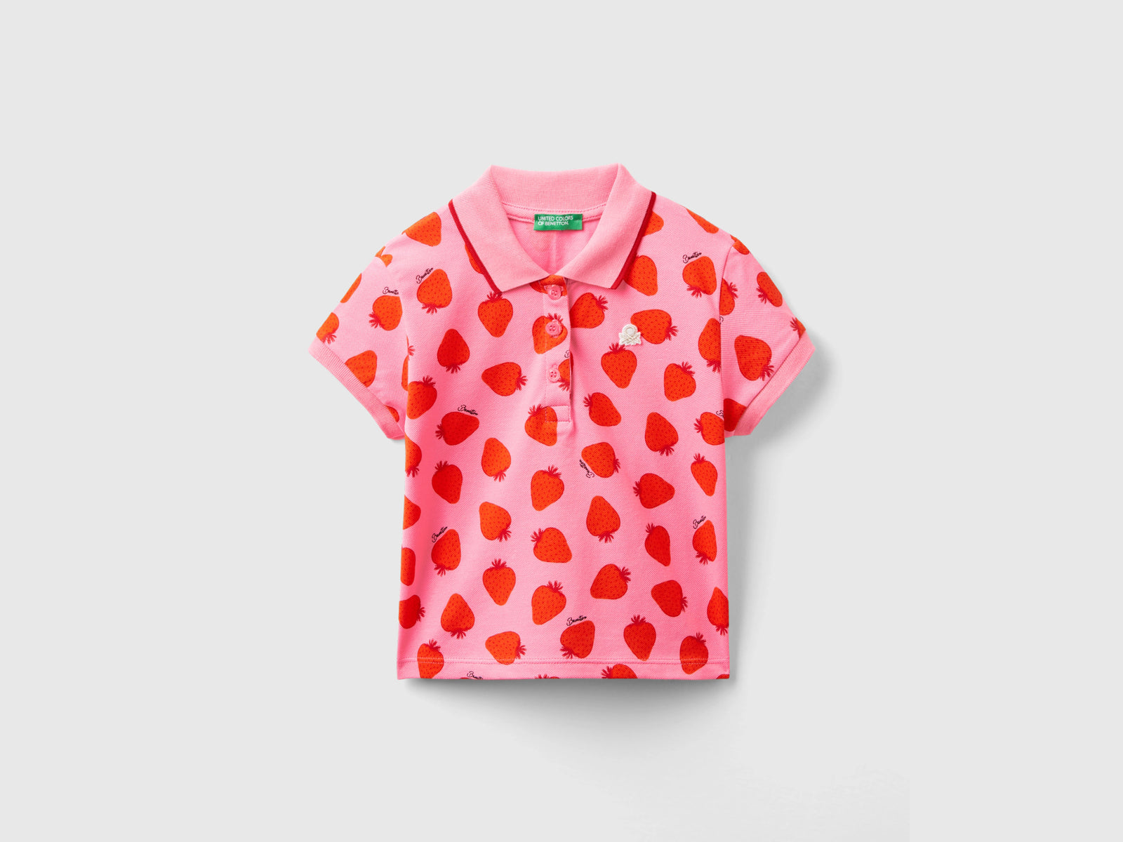 Polo con pattern fragole da bimba rosa | Benetton Outlet