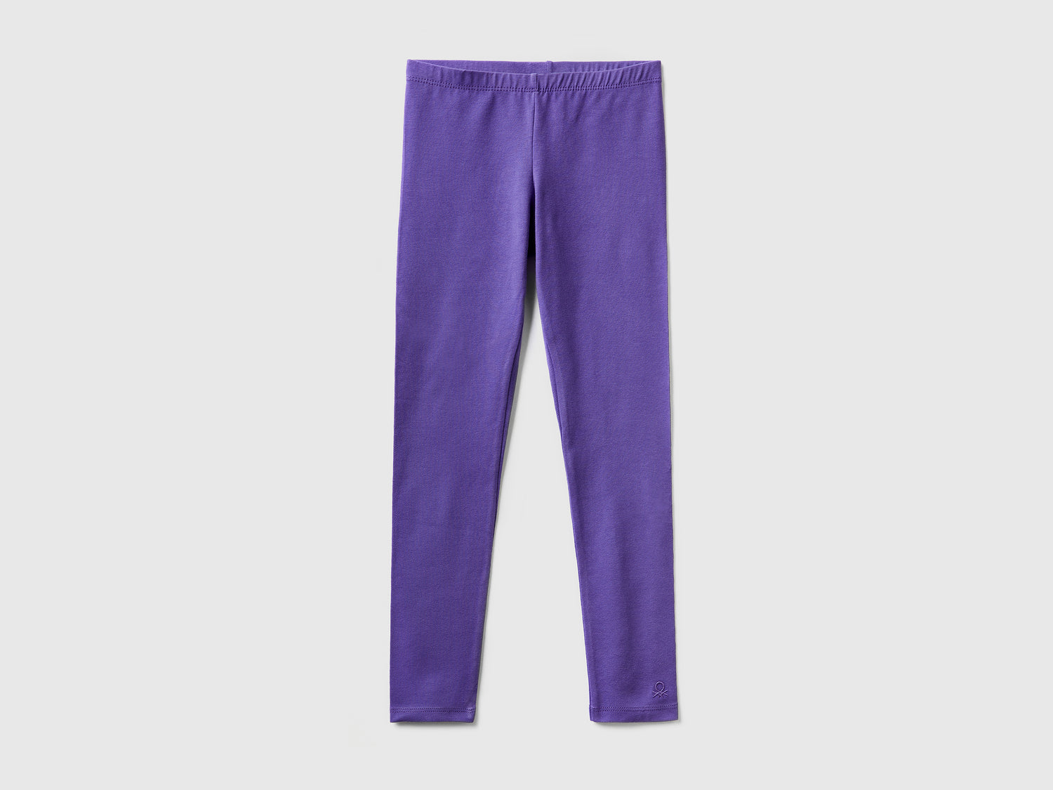 Leggings in cotone stretch con logo da bambina viola | Benetton Outlet
