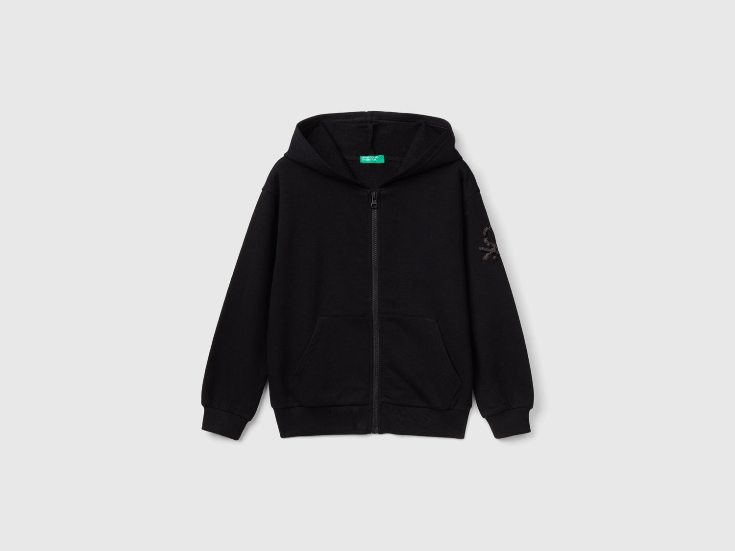 Felpa con zip e paillettes da bambina nero | Benetton Outlet