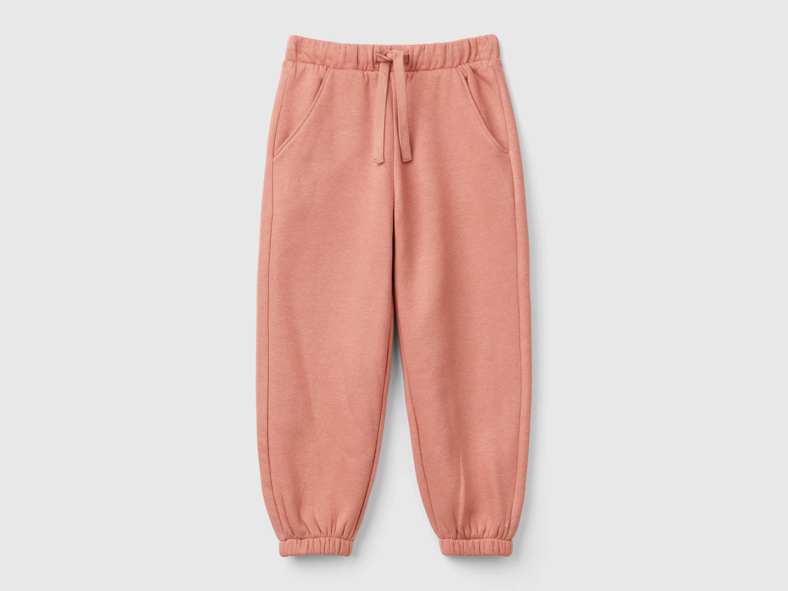 Joggers in felpa con coulisse da bimba salmone | Benetton Outlet