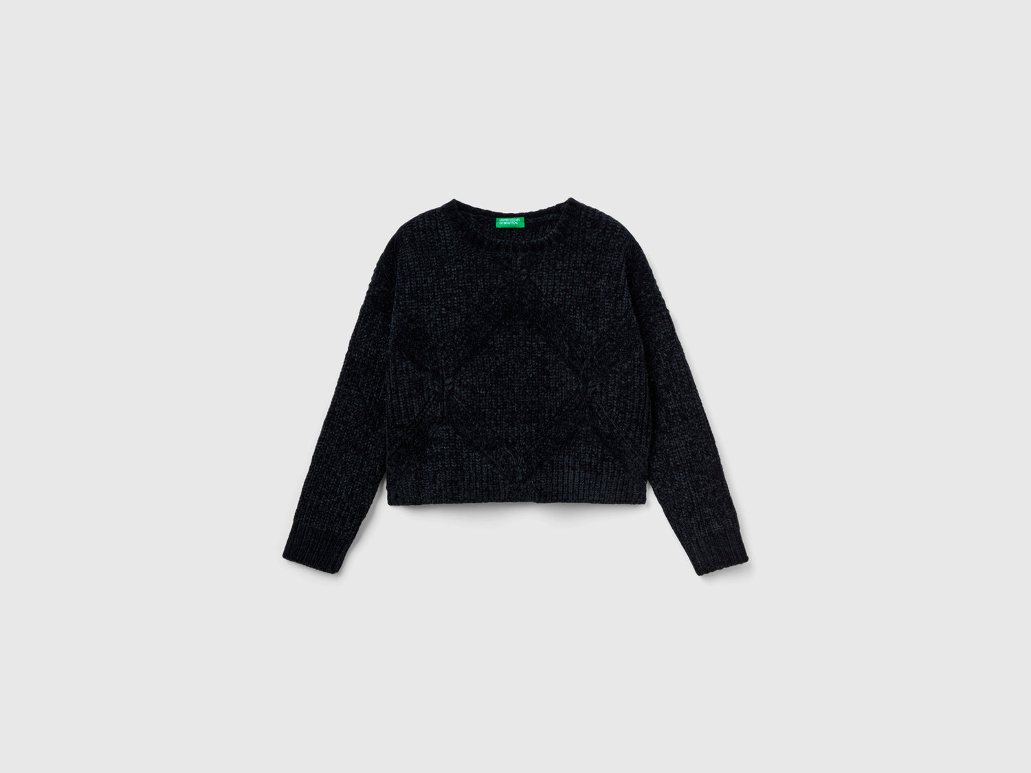 Maglia boxy fit in ciniglia da bambina nero | Benetton Outlet
