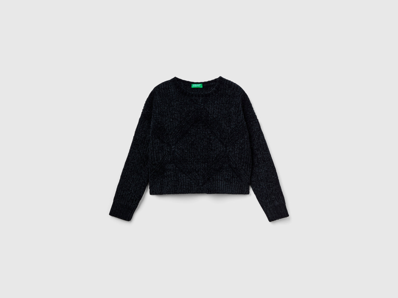 Maglia boxy fit in ciniglia da bambina nero | Benetton Outlet