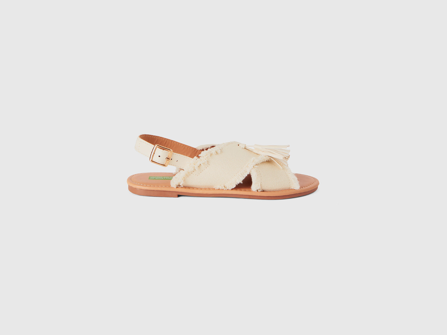 Sandali bassi con nappine da bambina bianco panna | Benetton Outlet
