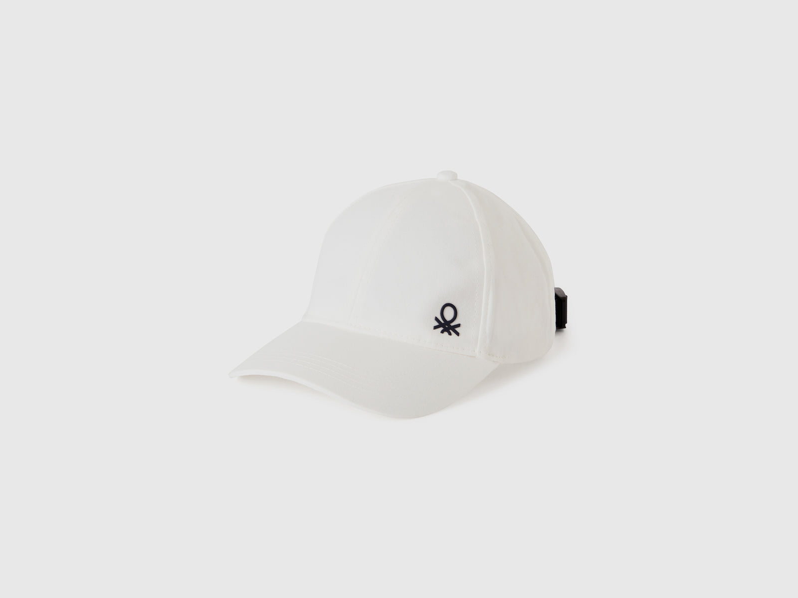 Cappellino con visiera da bambino bianco | Benetton Outlet