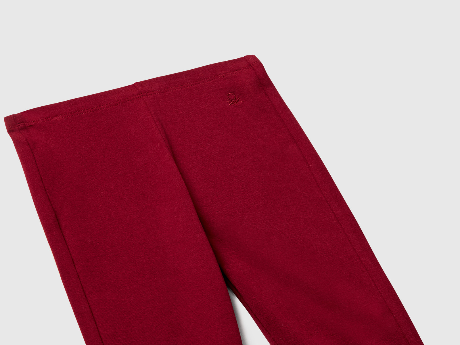 Leggings a zampa in cotone stretch da bambina bordeaux 3 | Benetton Outlet