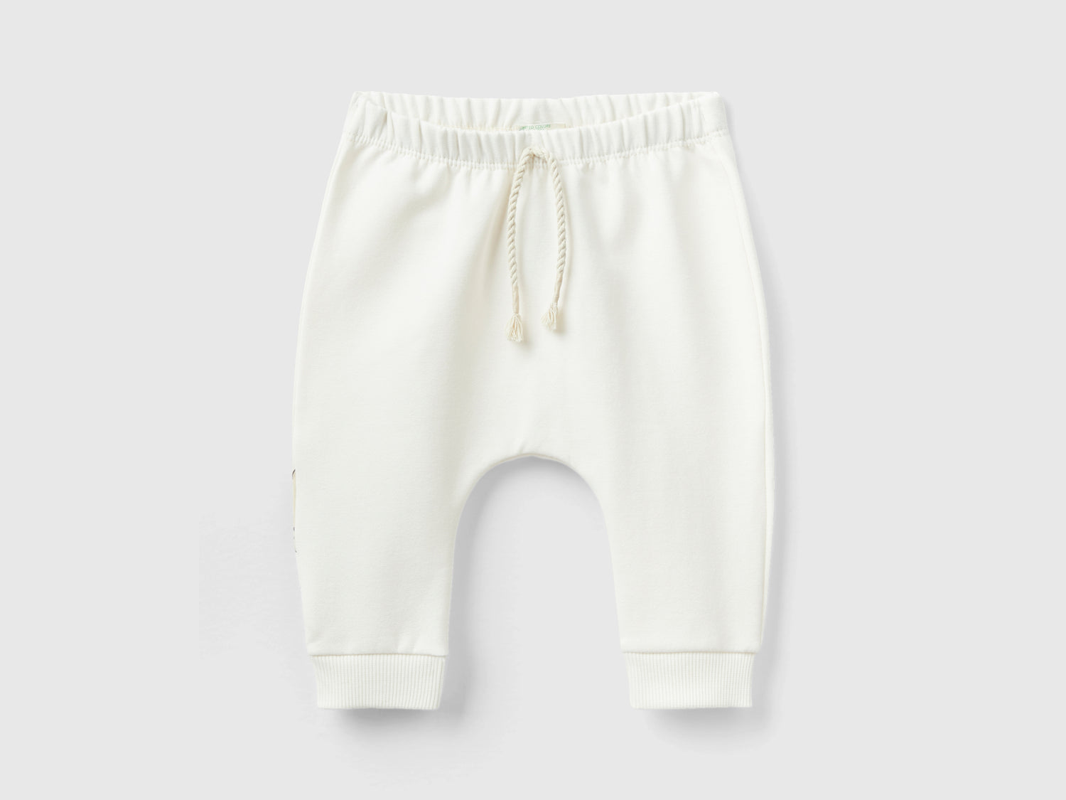 Pantaloni in calda felpa con taschino da neonato bianco panna | Benetton Outlet