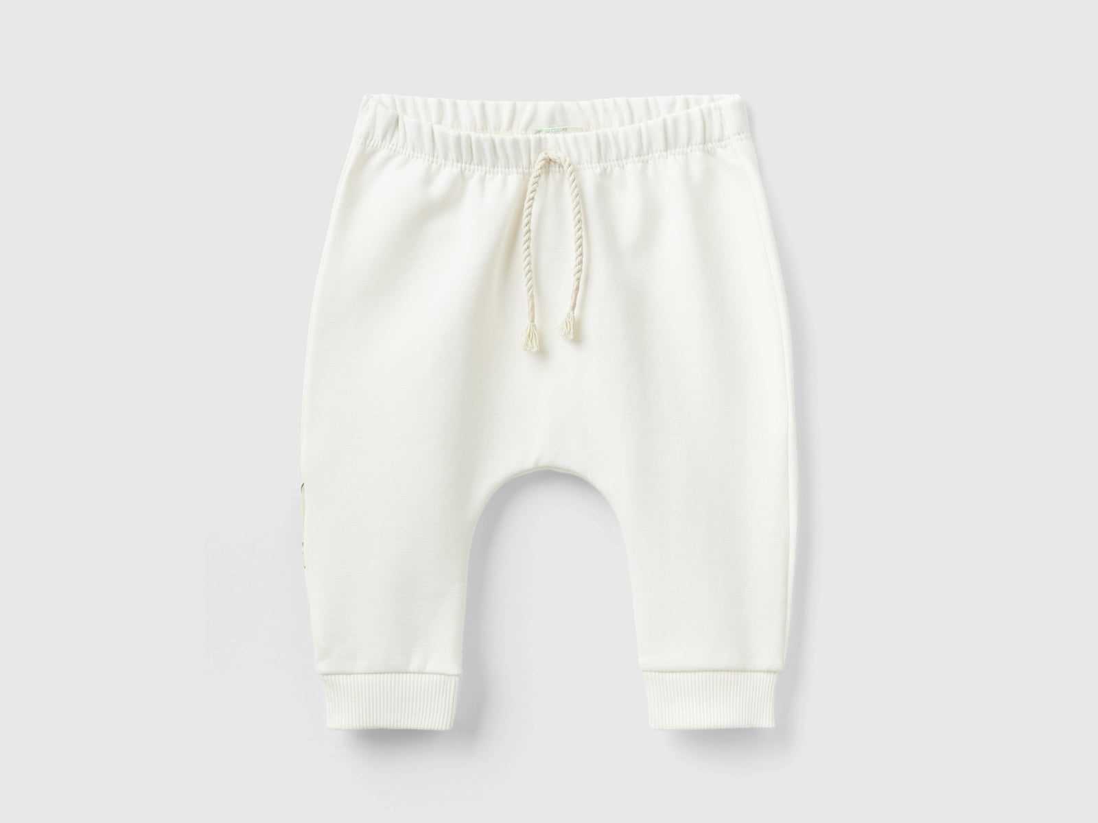 Pantaloni in calda felpa con taschino da neonato bianco panna | Benetton Outlet