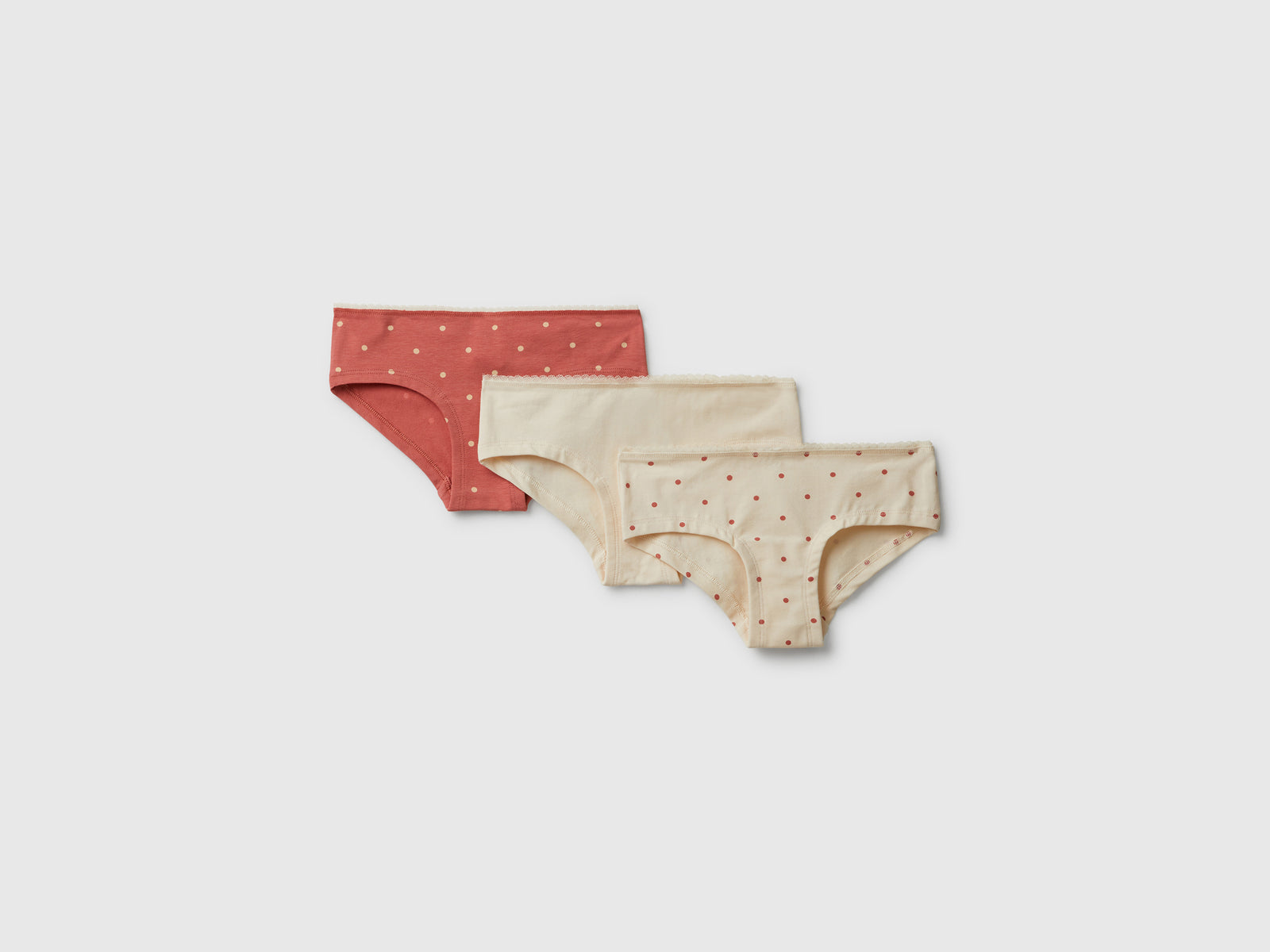 Tre slip in cotone stretch da bambina multi-color | Benetton Outlet