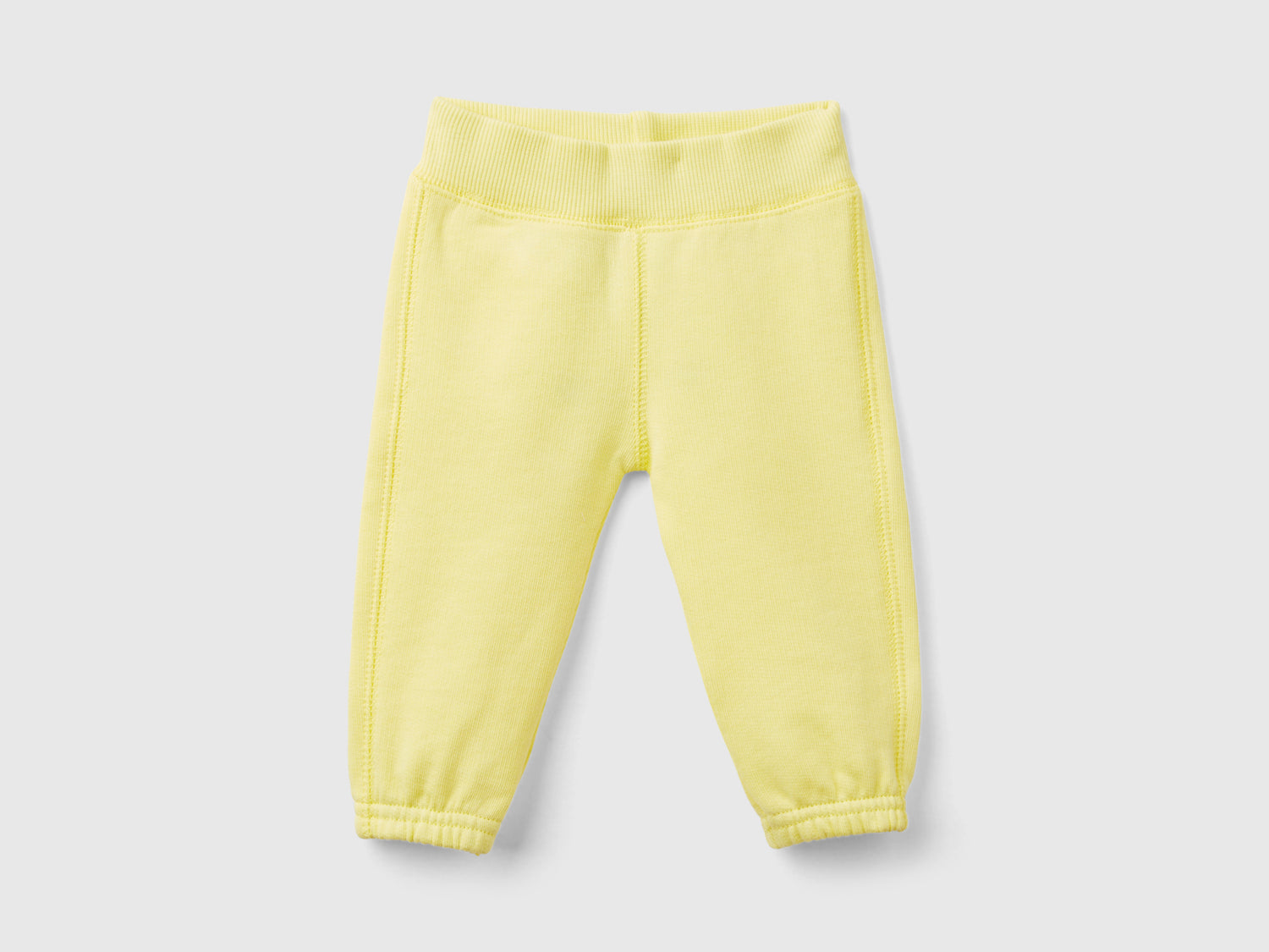 Pantaloni in felpa di cotone bio da neonato giallo | Benetton Outlet