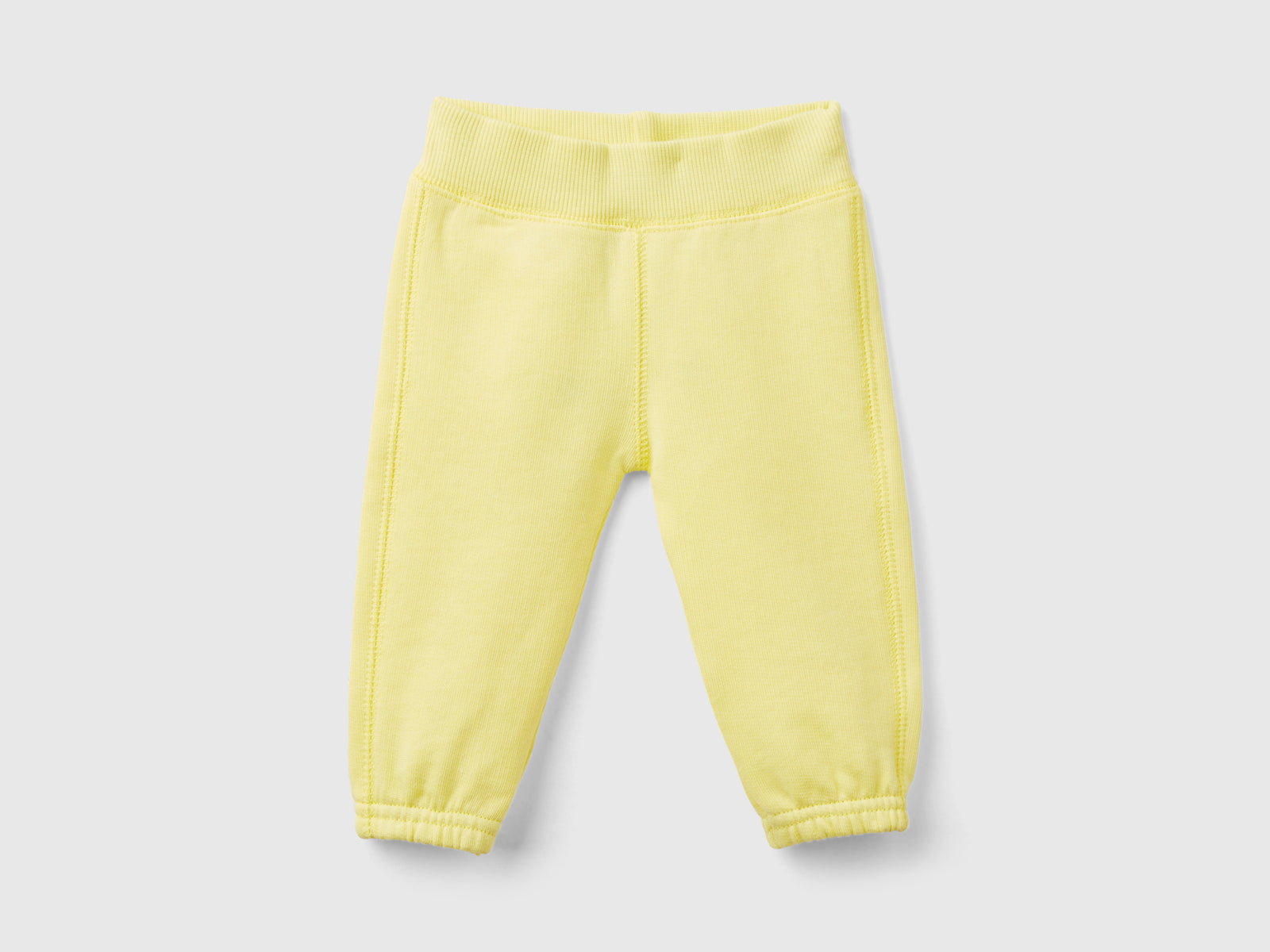 Pantaloni in felpa di cotone bio da neonato giallo | Benetton Outlet