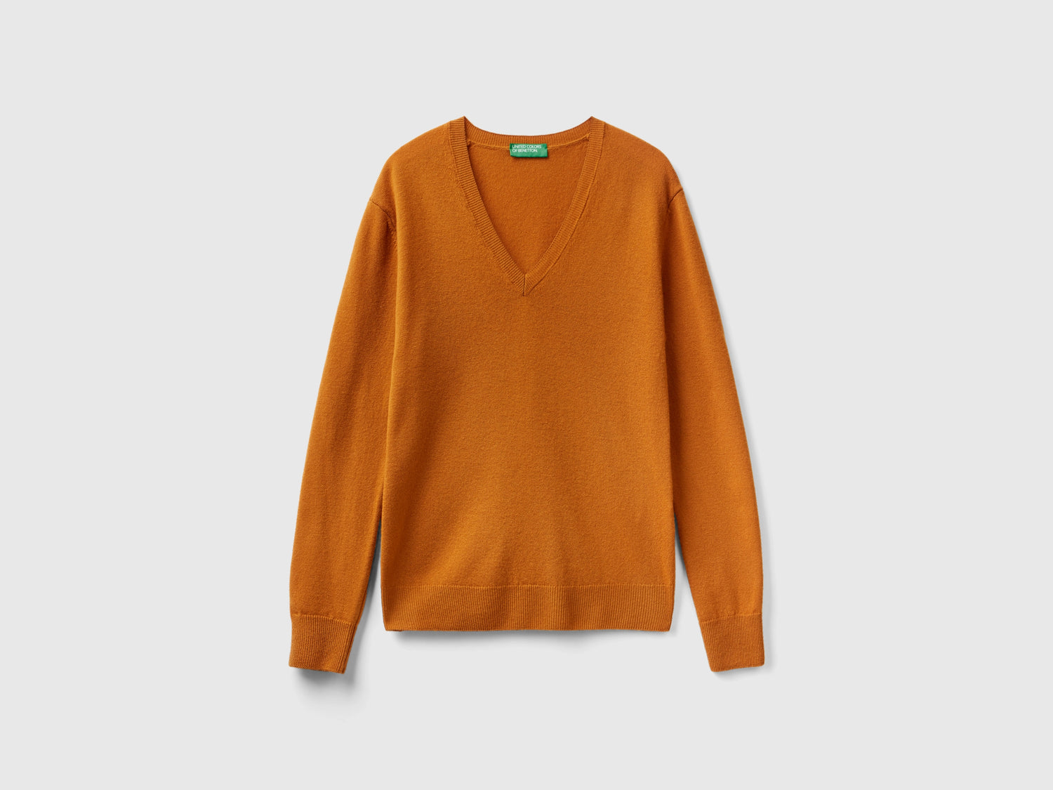 Maglia con scollo a V tabacco in pura lana Merino da donna bruciato | Benetton Outlet