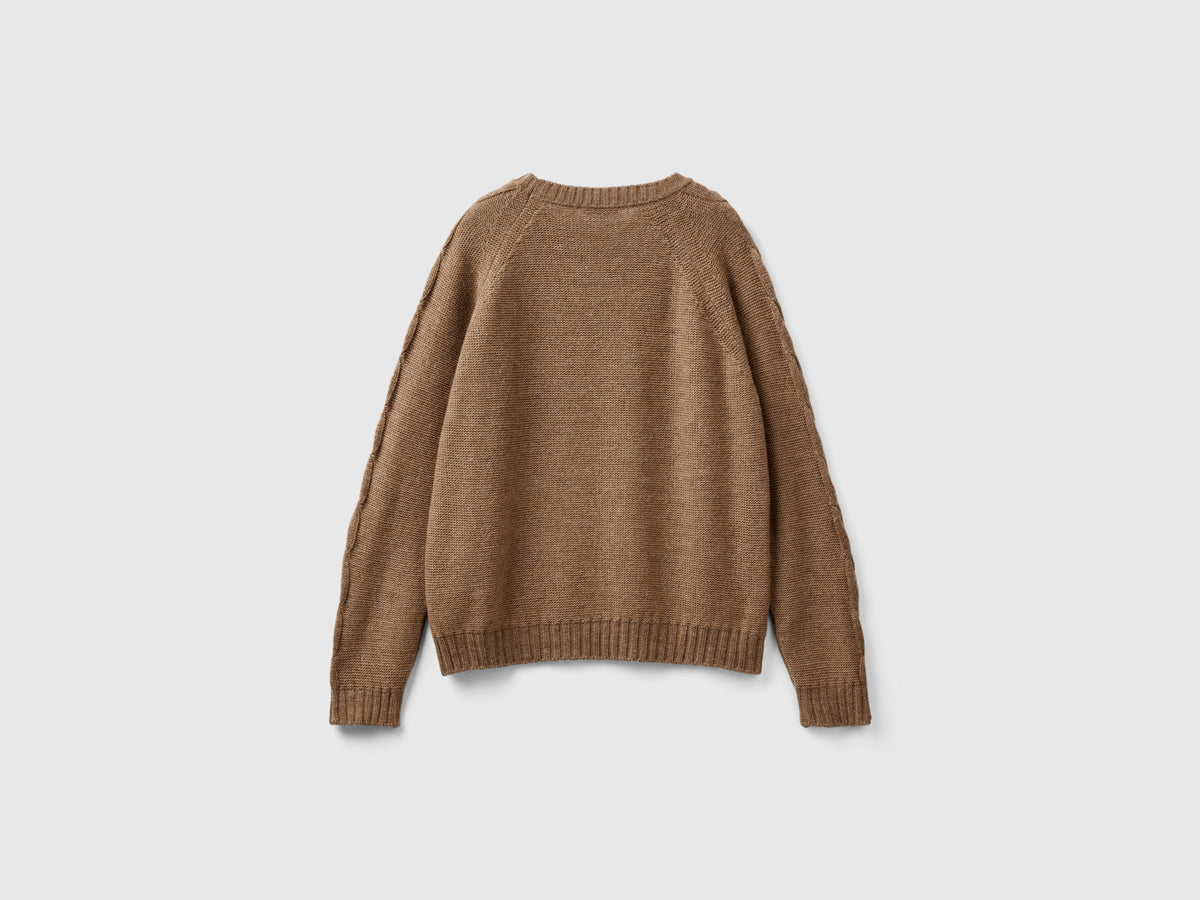 Maglione con trecce e losanghe
