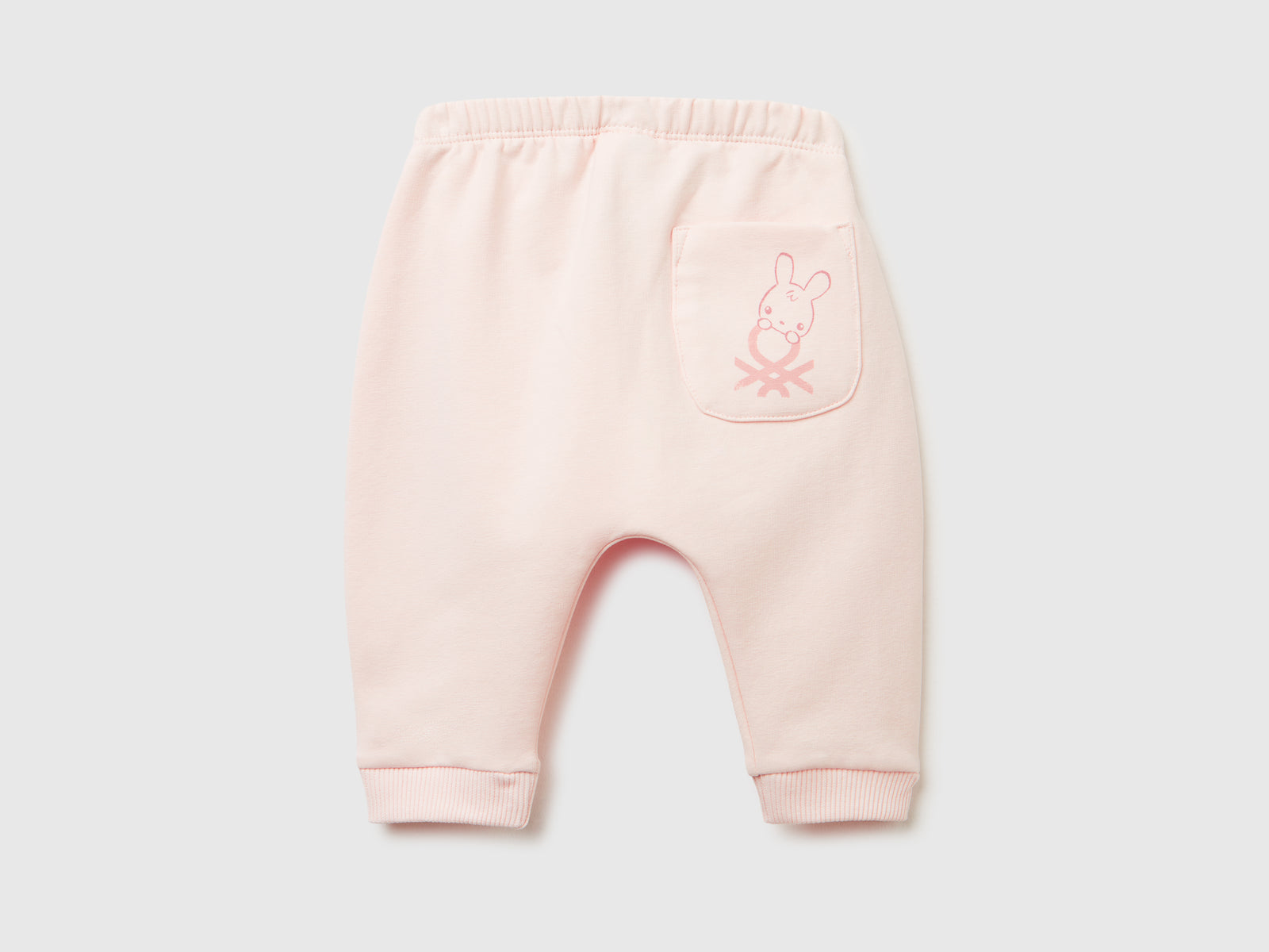 Pantaloni in calda felpa con taschino da neonato rosa tenue 2 | Benetton Outlet