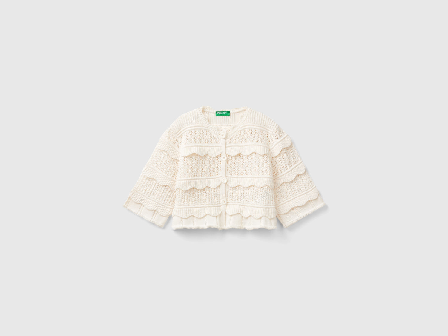 Cardigan lavorato con bottoni da bambina bianco panna | Benetton Outlet