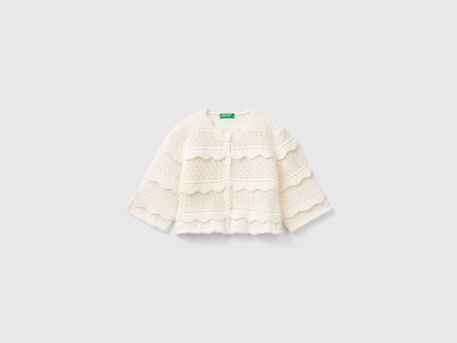Cardigan lavorato con bottoni da bambina bianco panna | Benetton Outlet