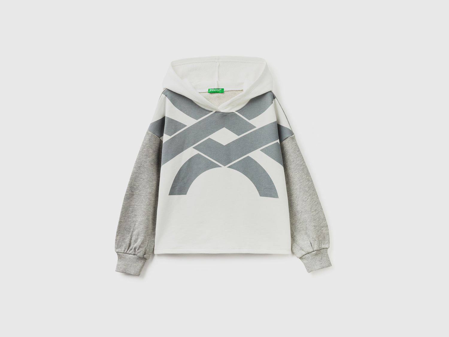 Felpa over fit con cappuccio da bambina bianco panna | Benetton Outlet