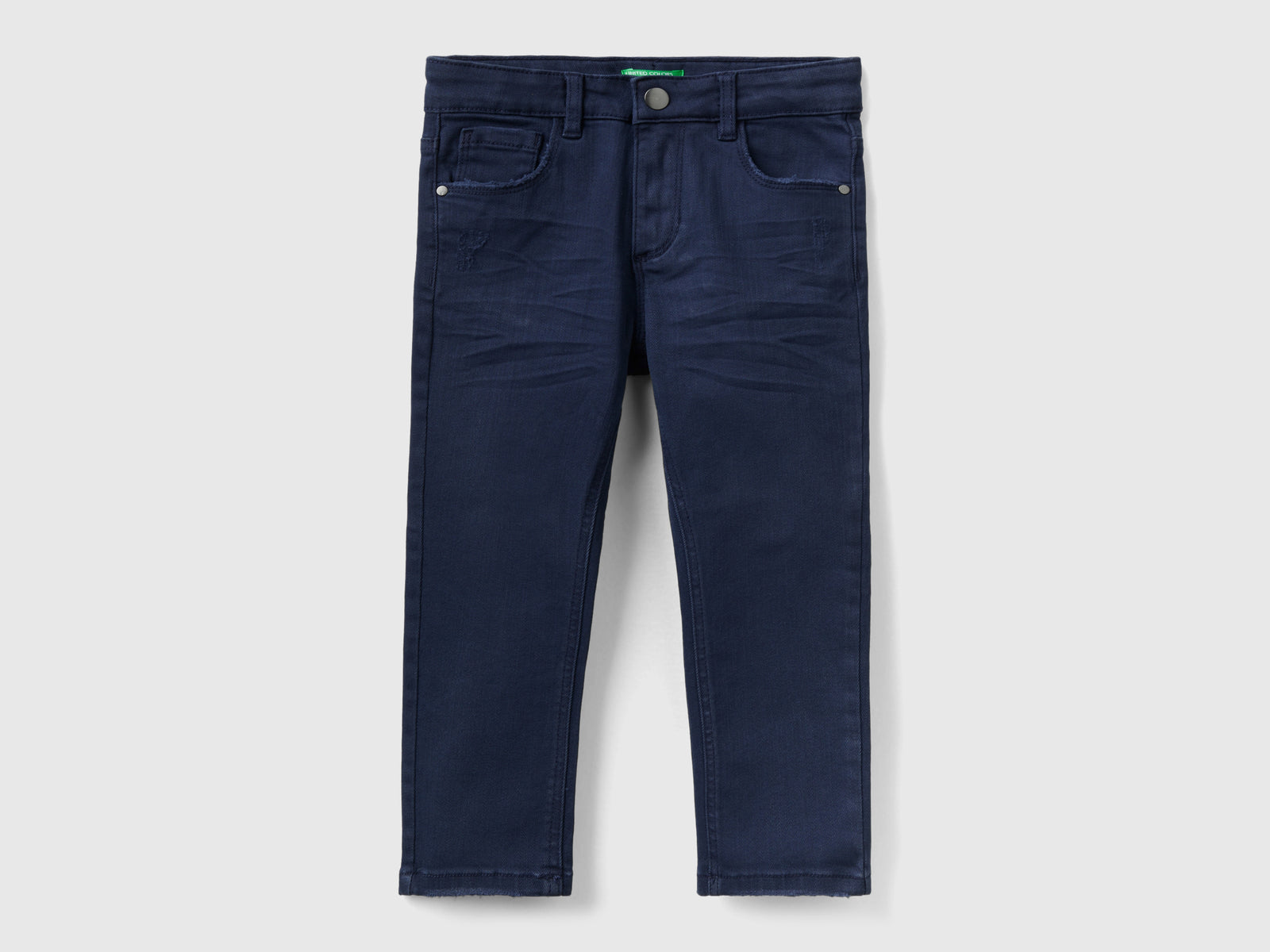 Jeans con piccole rotture da bimbo blu scuro | Benetton Outlet