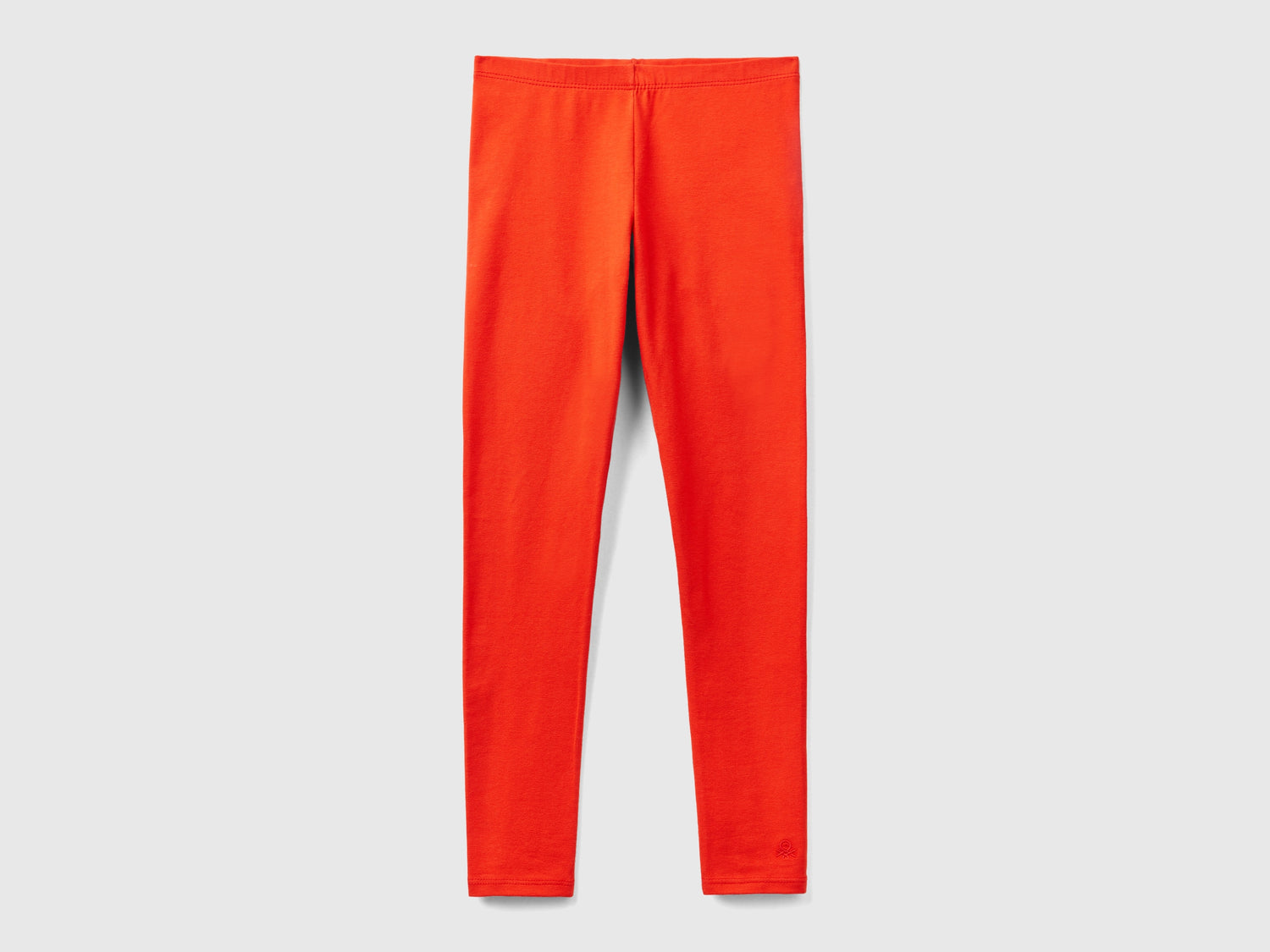 Leggings in cotone stretch con logo da bambina rosso | Benetton Outlet
