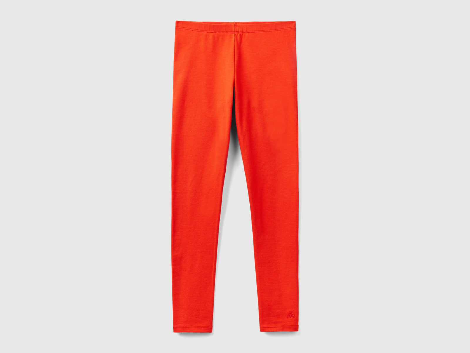 Leggings in cotone stretch con logo da bambina rosso | Benetton Outlet
