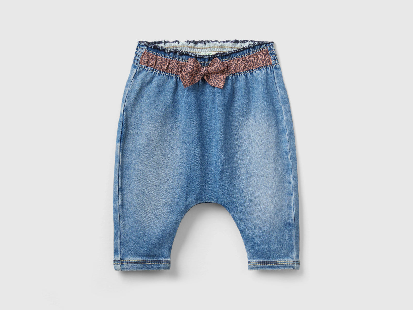 Jeans termici con fiocco animalier da neonato azzurro | Benetton Outlet