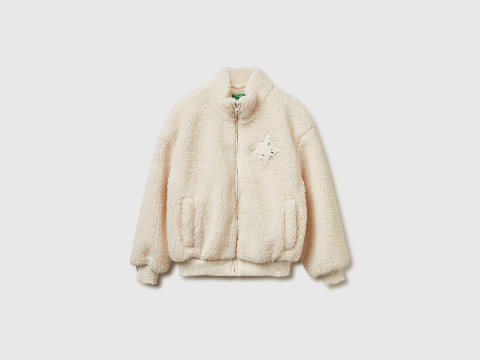 Felpa con collo alto in pelliccetta sintetica da bambina bianco panna | Benetton Outlet