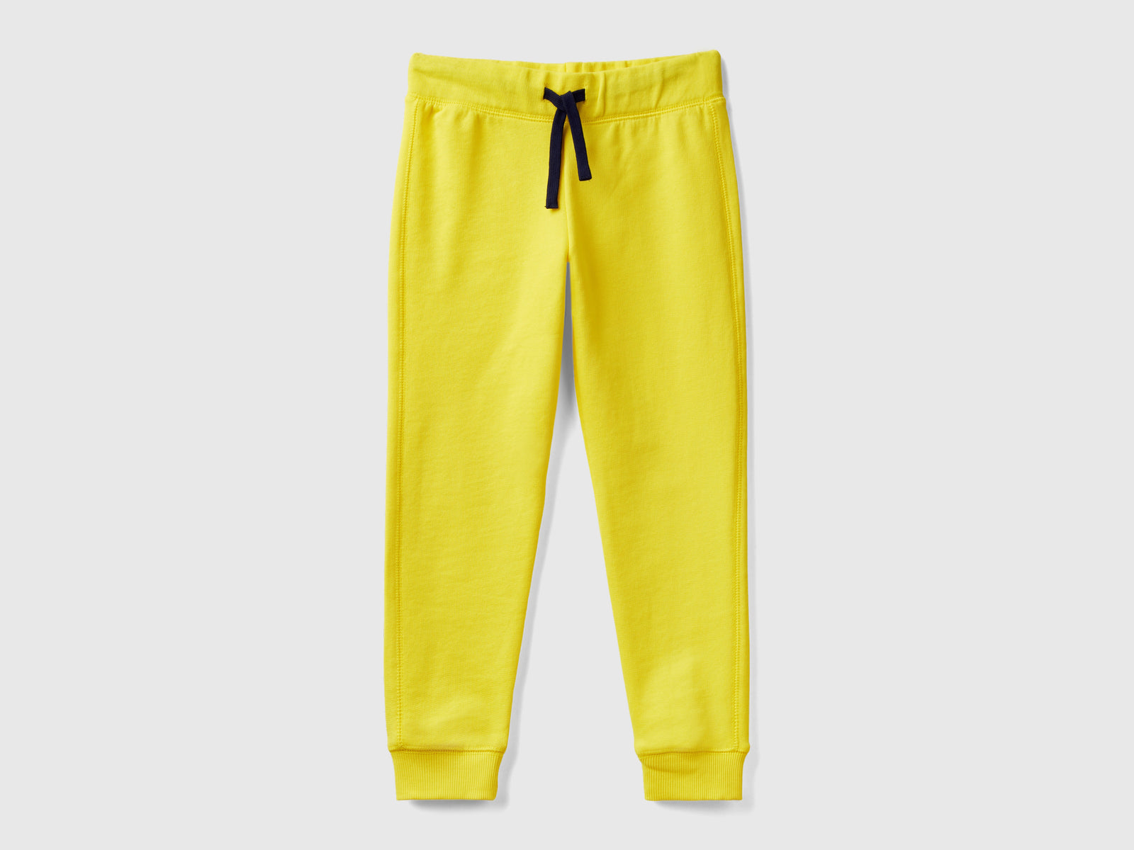 Pantaloni in felpa 100% cotone da bambino giallo | Benetton Outlet