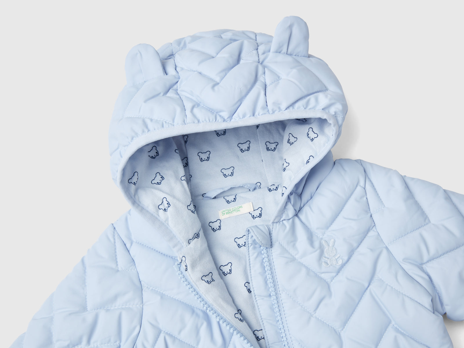 Piumino imbottito con orecchie da neonato celeste 3 | Benetton Outlet