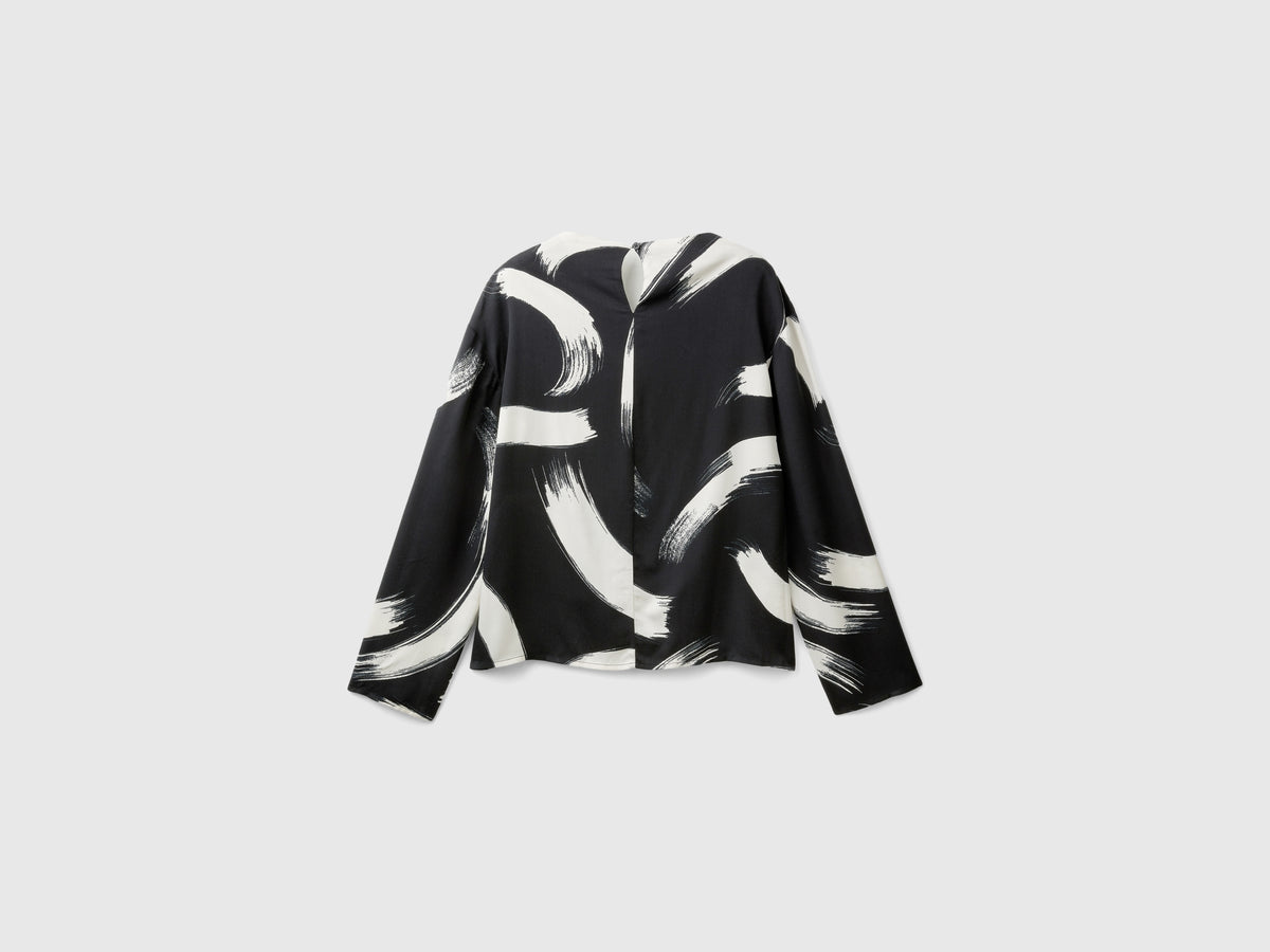 Blusa fluida fantasia