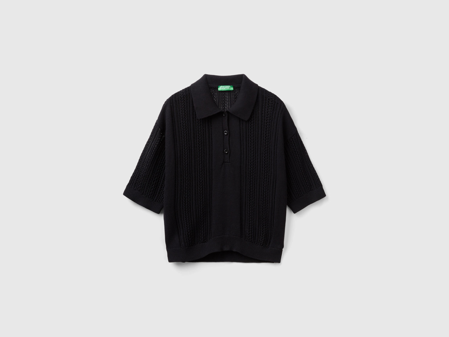 Polo in maglia crochet da donna nero | Benetton Outlet