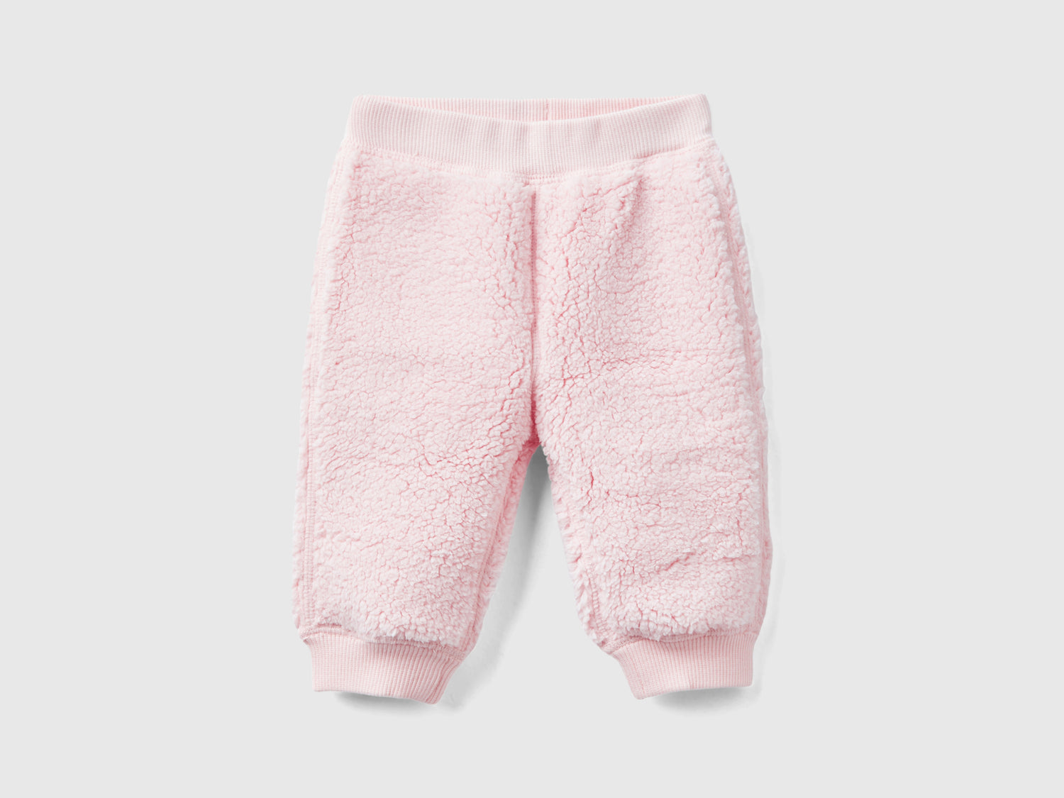 Pantaloni reversibili con coniglietti da neonato rosa tenue | Benetton Outlet