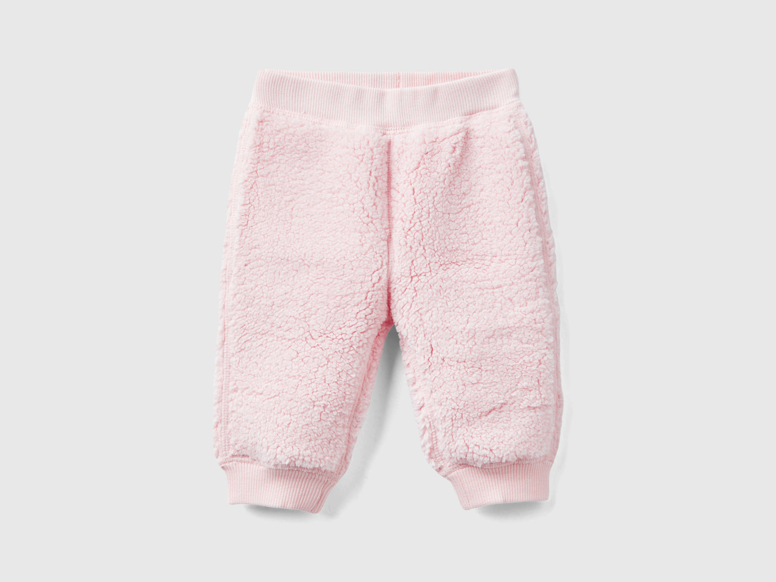 Pantaloni reversibili con coniglietti da neonato rosa tenue | Benetton Outlet