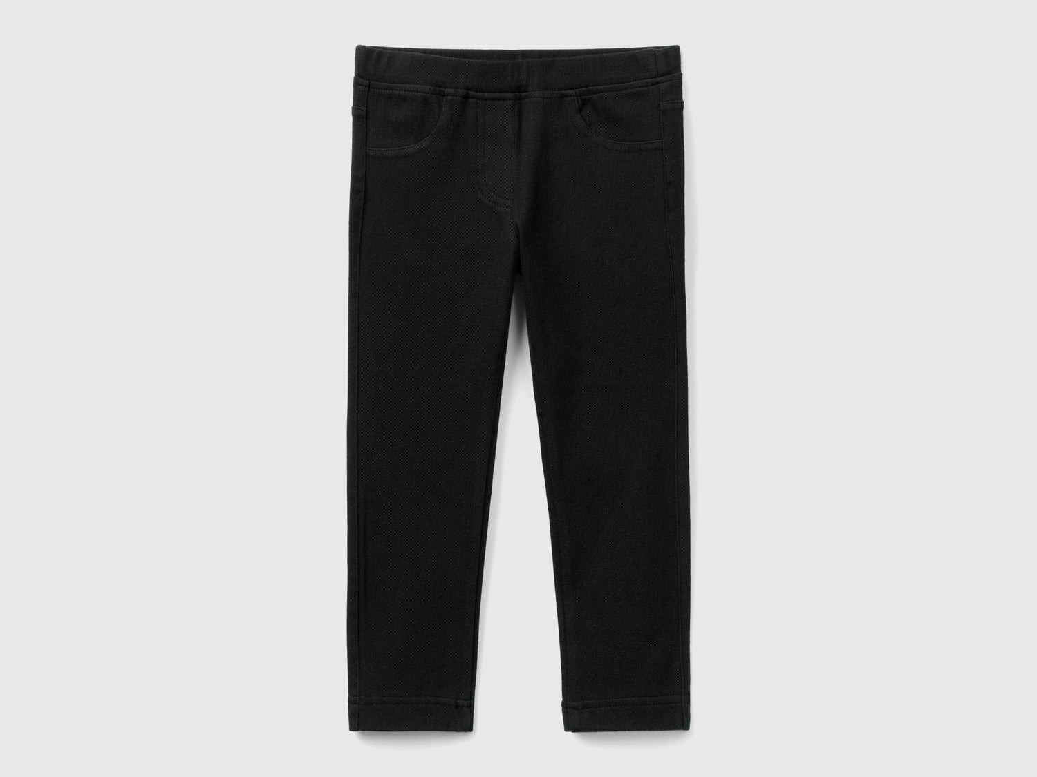 Pantaloni in felpa super stretch da bimba nero | Benetton Outlet