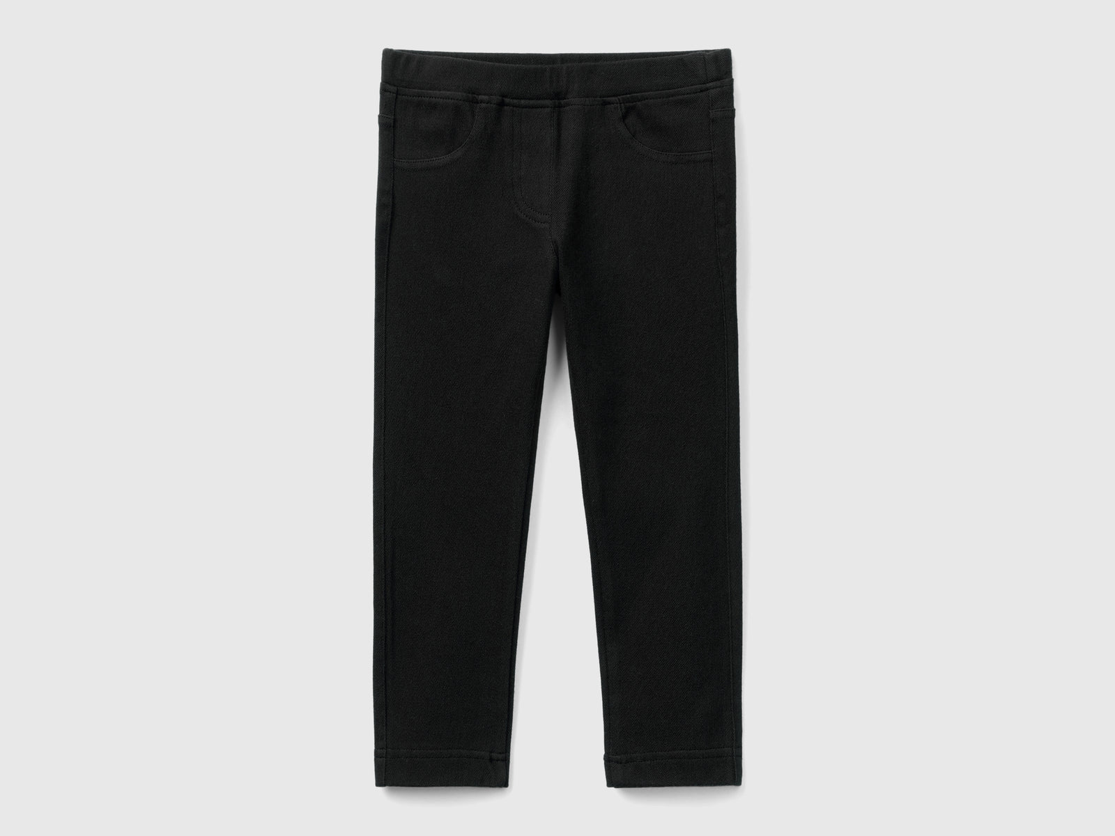 Pantaloni in felpa super stretch da bimba nero | Benetton Outlet