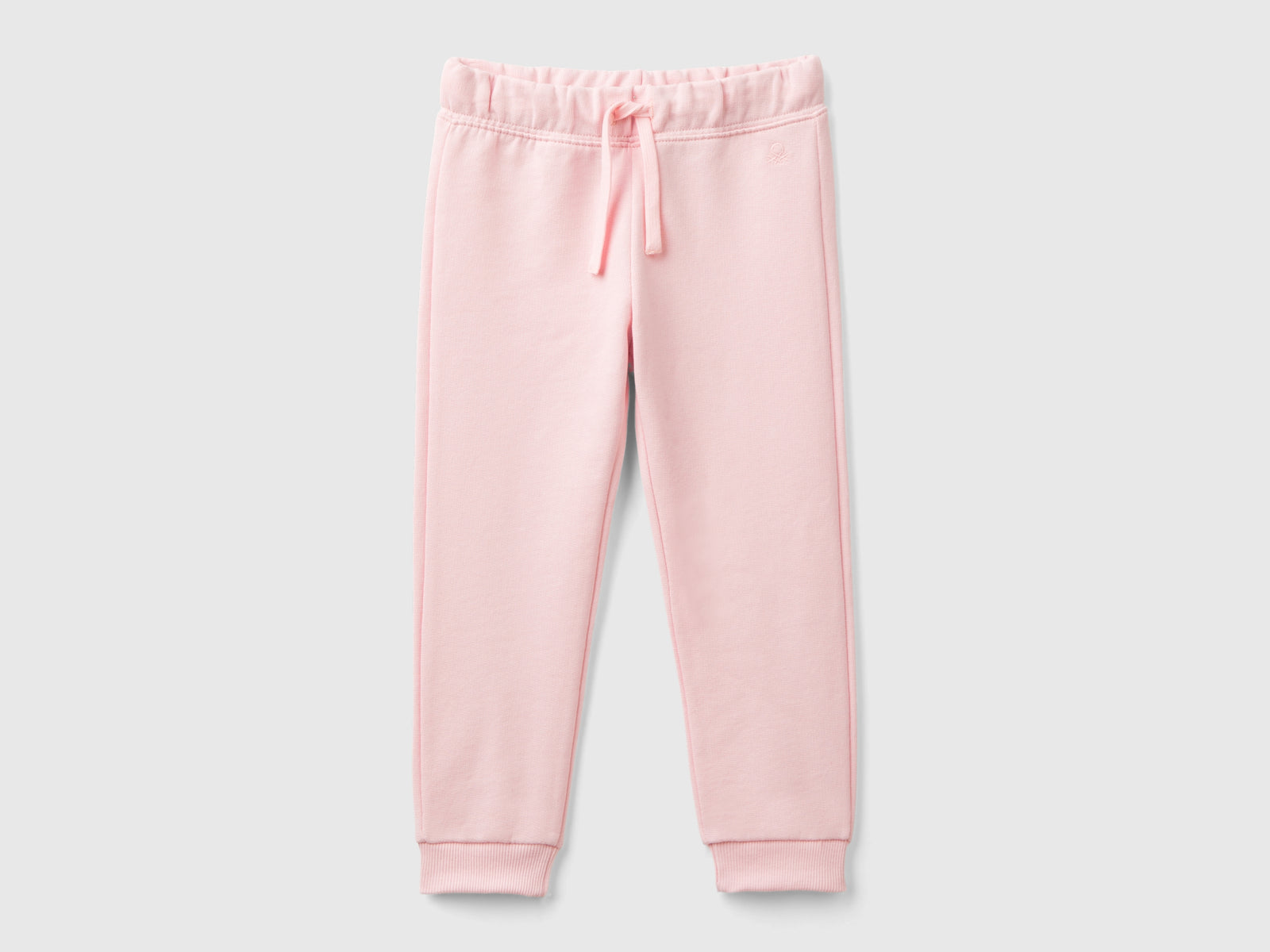 Pantaloni in felpa di cotone bio da bimba rosa | Benetton Outlet