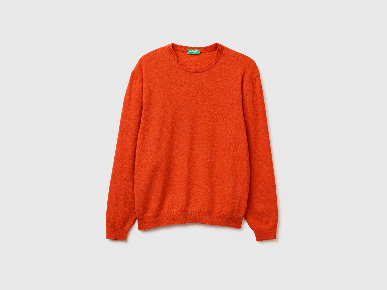 Maglia girocollo mélange in pura lana Merino da uomo arancione | Benetton Outlet