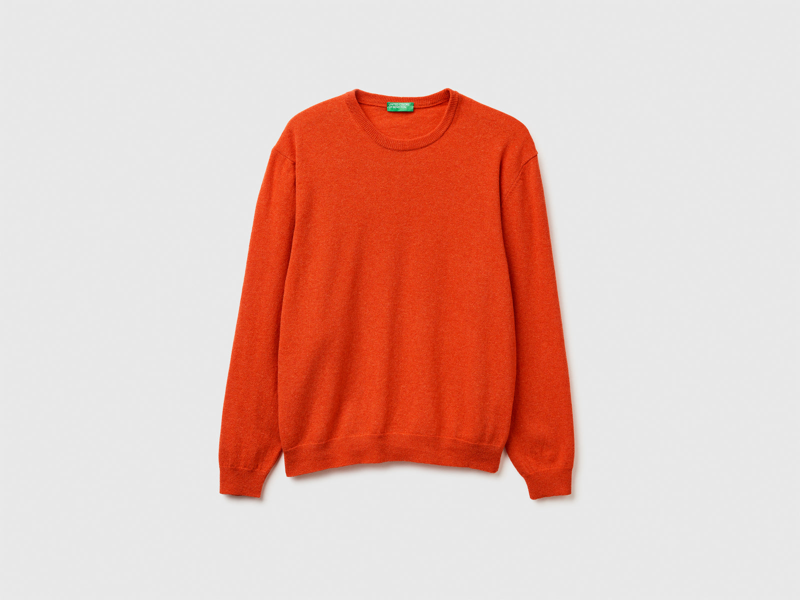 Maglia girocollo mélange in pura lana Merino da uomo arancione | Benetton Outlet